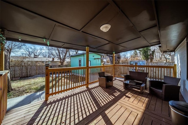 deck featuring an outdoor structure and outdoor lounge area