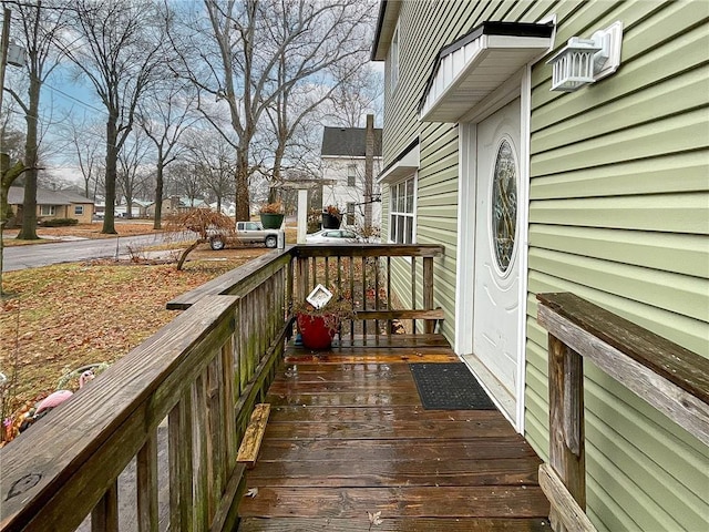 wooden deck with an AC wall unit