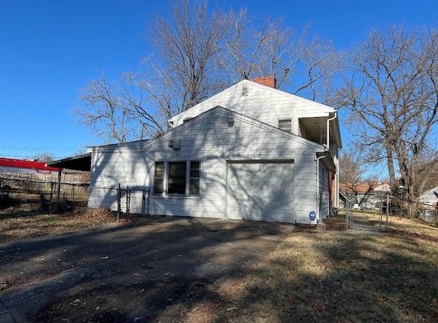 view of property exterior featuring a garage