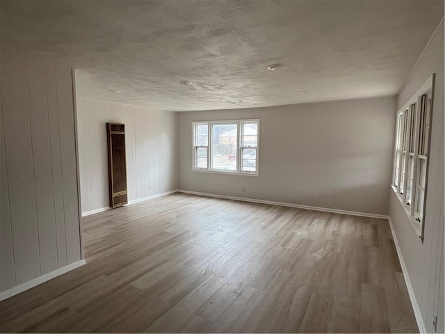 spare room featuring hardwood / wood-style flooring