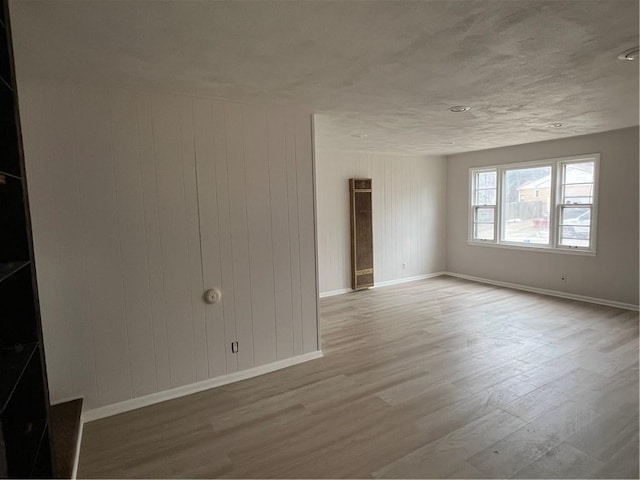 unfurnished room featuring light hardwood / wood-style flooring