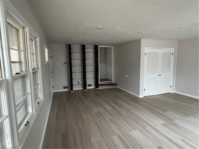 spare room with hardwood / wood-style flooring