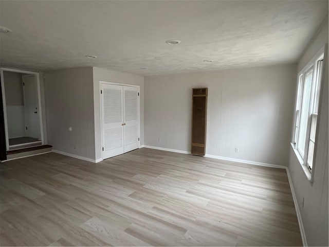 unfurnished room featuring light hardwood / wood-style flooring