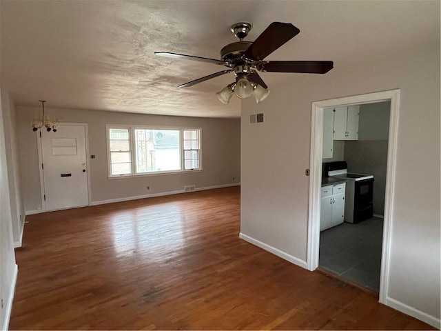 empty room featuring ceiling fan and wood-type flooring