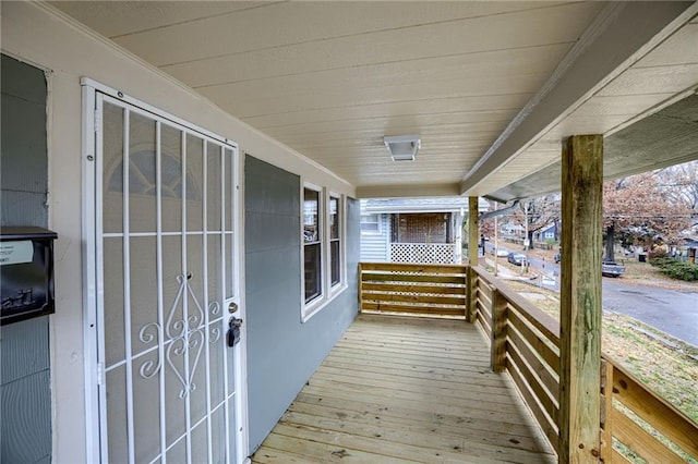 wooden terrace featuring a porch