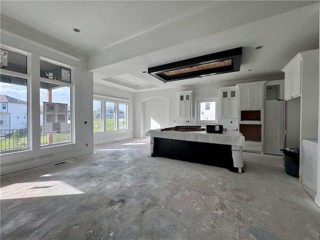 10332 N Potter Ave, Kansas City, MO 64157 - kitchen featuring a kitchen island, white cabinetry, healthy amount of natural light, and open floor plan