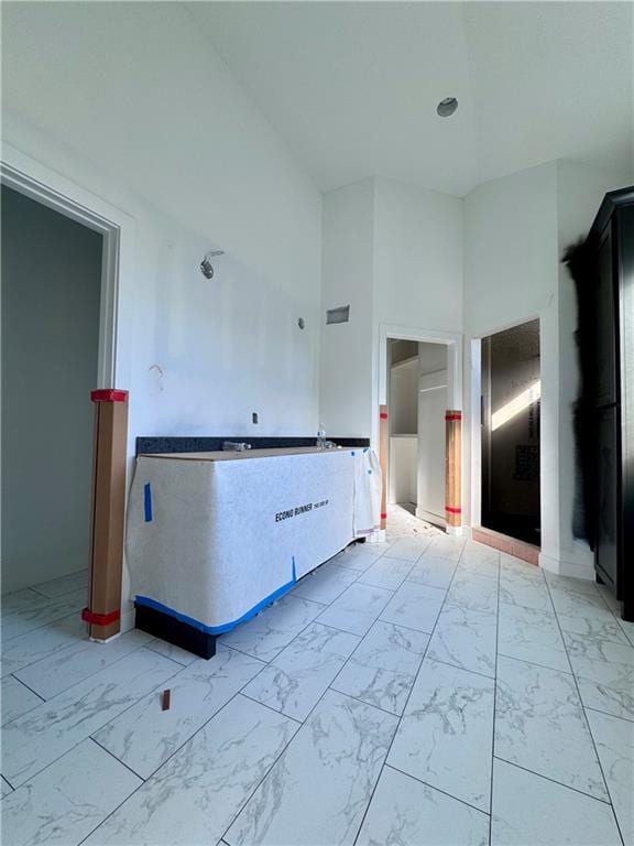 10332 N Potter Ave, Kansas City, MO 64157 - kitchen with light marble finish floors and a towering ceiling