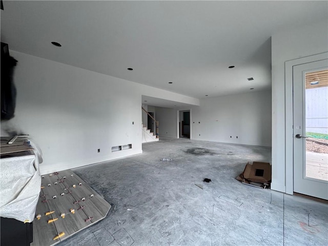 10332 N Potter Ave, Kansas City, MO 64157 - unfurnished living room with stairway