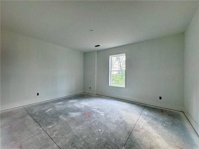 10332 N Potter Ave, Kansas City, MO 64157 - empty room featuring unfinished concrete flooring and baseboards