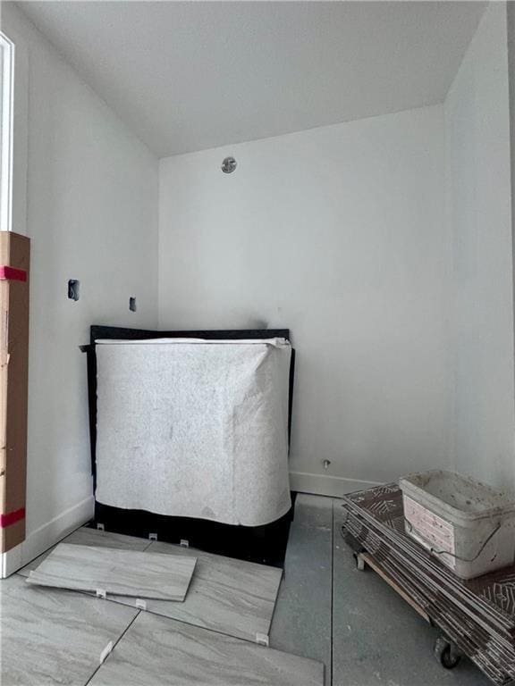 10332 N Potter Ave, Kansas City, MO 64157 - bedroom featuring baseboards and concrete flooring