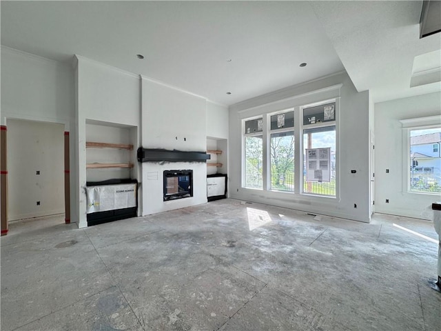 10332 N Potter Ave, Kansas City, MO 64157 - unfurnished living room featuring a glass covered fireplace and crown molding