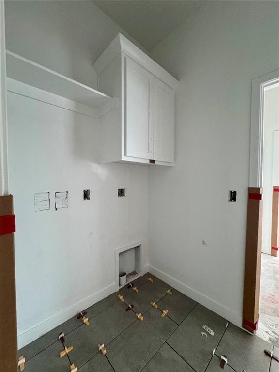10332 N Potter Ave, Kansas City, MO 64157 - laundry room featuring cabinet space, baseboards, and hookup for a washing machine