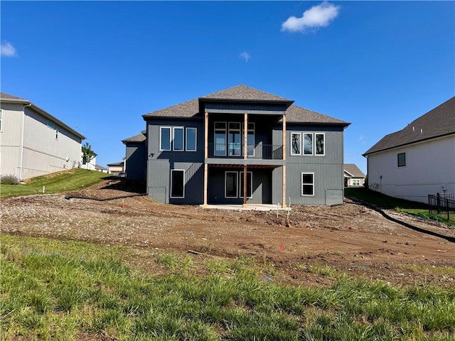 10332 N Potter Ave, Kansas City, MO 64157 - rear view of house featuring a balcony and a shingled roof