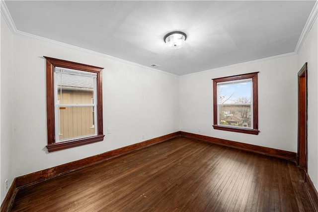 spare room featuring hardwood / wood-style flooring and ornamental molding