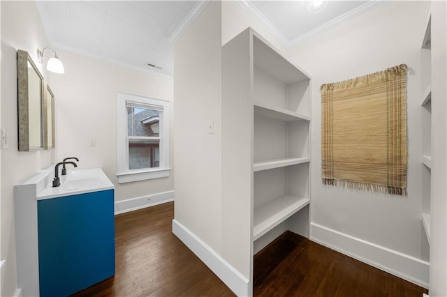 bathroom with crown molding and wood-type flooring