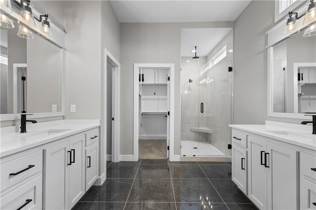 bathroom with vanity, tile patterned floors, and walk in shower