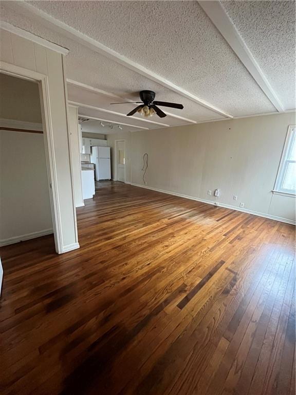 unfurnished living room featuring hardwood / wood-style floors, a textured ceiling, and ceiling fan