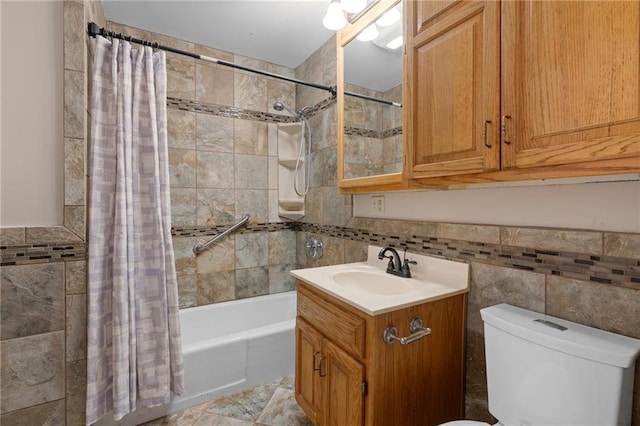 full bathroom featuring tile walls, vanity, toilet, and shower / bathtub combination with curtain