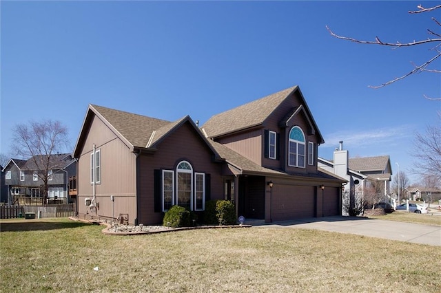 traditional-style house with fence, a front lawn, concrete driveway, a garage, and a residential view