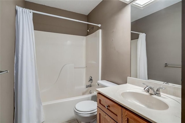 bathroom with vanity, toilet, and shower / tub combo