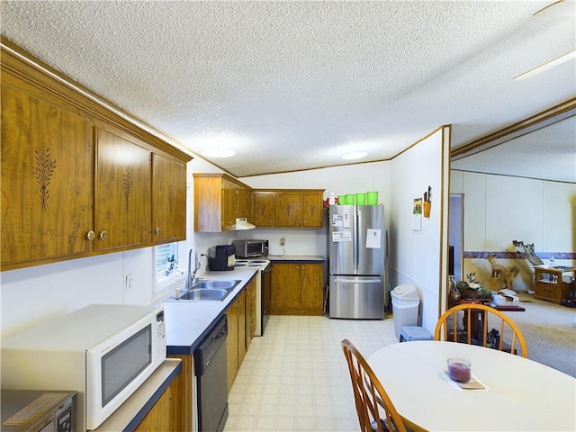 kitchen with sink, a textured ceiling, stainless steel fridge, dishwasher, and electric stove