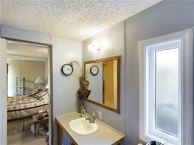 bathroom with vanity and a textured ceiling