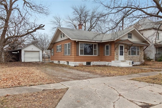 view of front of home with an outbuilding and a garage