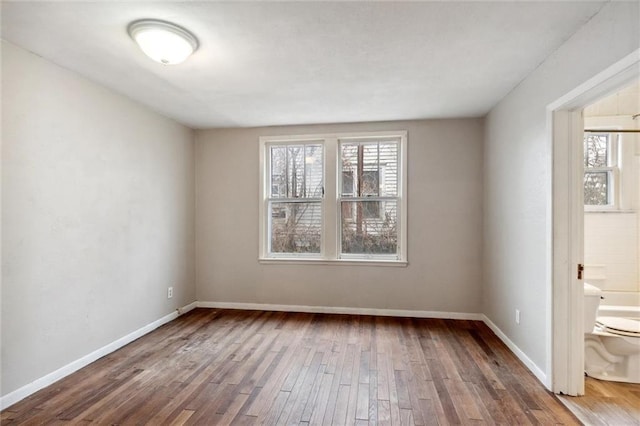 spare room featuring dark hardwood / wood-style floors