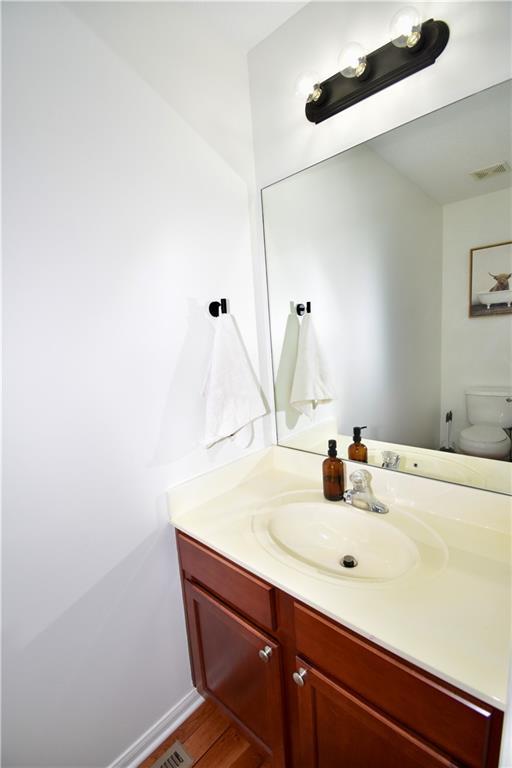 bathroom with vanity and toilet