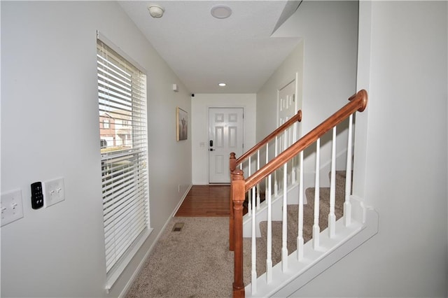 view of carpeted foyer