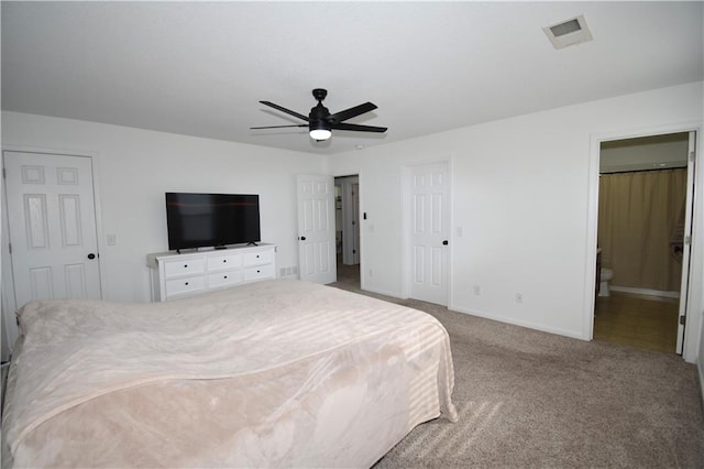 carpeted bedroom with ceiling fan and connected bathroom