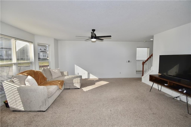 living room featuring ceiling fan and carpet flooring