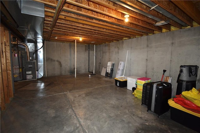 basement with heating unit and water heater