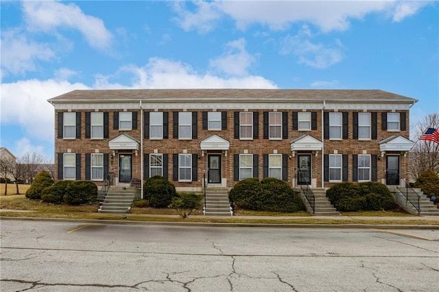 view of front of home with brick siding