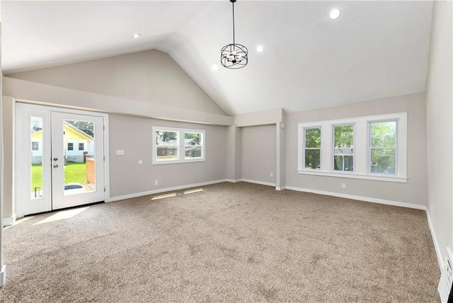 unfurnished living room featuring carpet floors and a healthy amount of sunlight