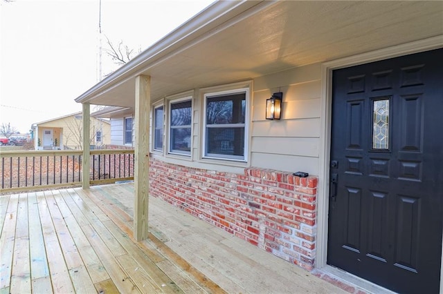 property entrance with a wooden deck