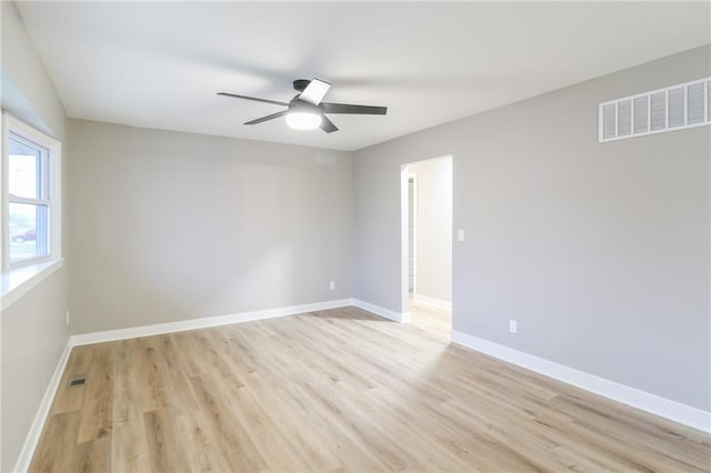 unfurnished room featuring ceiling fan and light hardwood / wood-style flooring