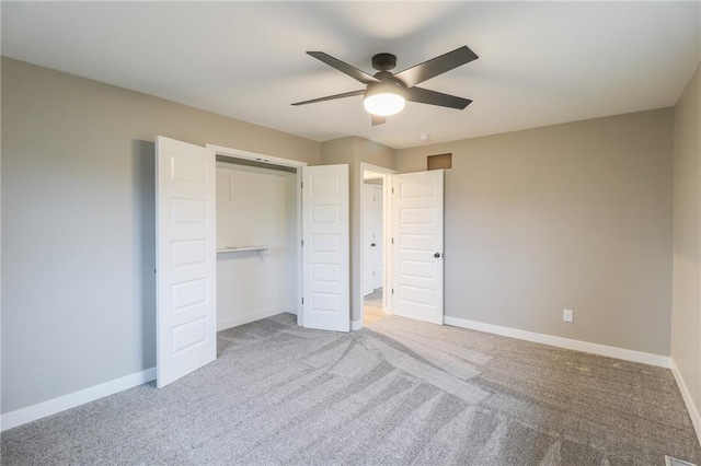 unfurnished bedroom with light carpet, a closet, and ceiling fan