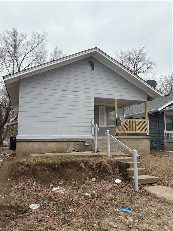 view of side of home featuring a porch