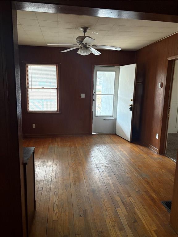 spare room featuring hardwood / wood-style flooring and ceiling fan