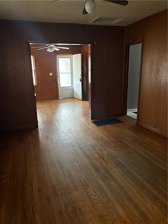 spare room with hardwood / wood-style flooring and ceiling fan