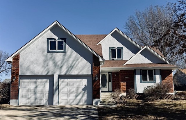 view of front of property featuring stucco siding, concrete driveway, and brick siding