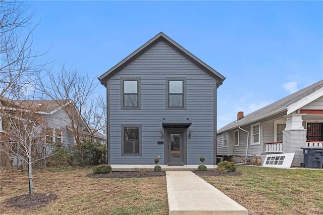 view of front of home featuring a front lawn and a porch