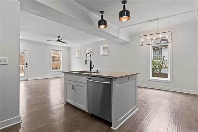 kitchen featuring dishwasher, an island with sink, sink, hanging light fixtures, and crown molding