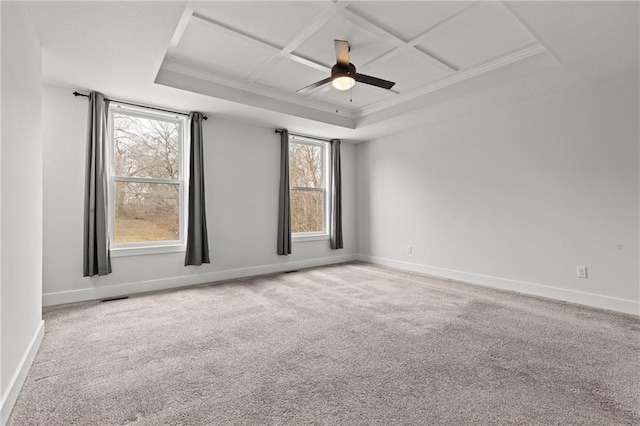 spare room featuring ornamental molding, coffered ceiling, ceiling fan, and carpet flooring