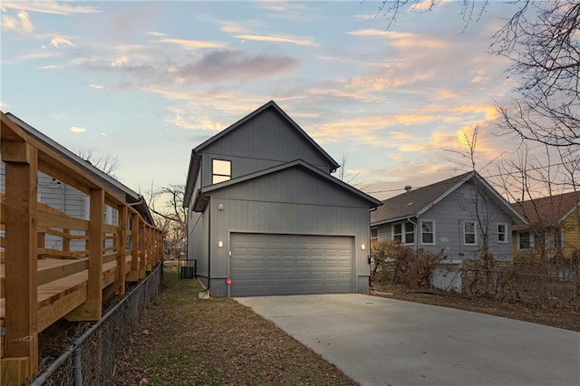 view of front of house featuring central AC and a garage