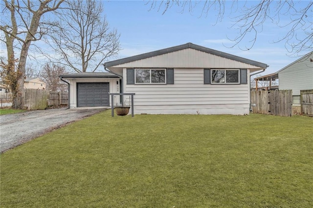 view of front facade featuring a garage and a front lawn