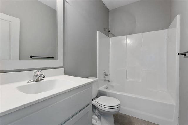 full bathroom featuring tile patterned flooring, vanity, shower / bathing tub combination, and toilet