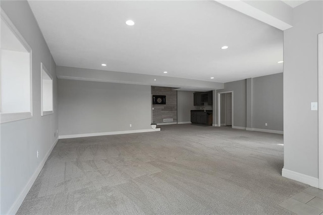 unfurnished living room with light carpet