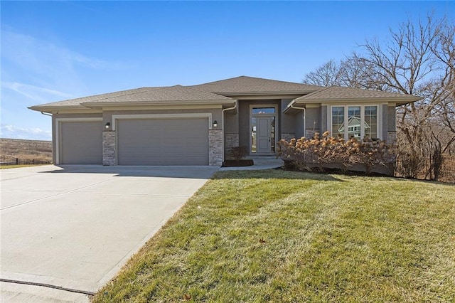 prairie-style home with a garage and a front yard